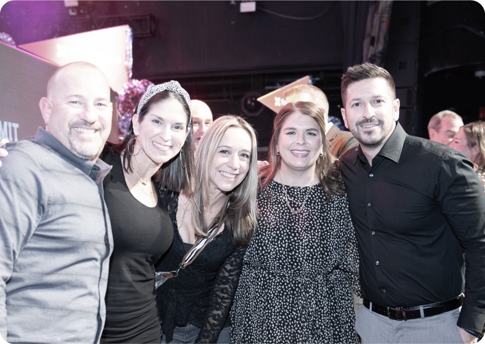 group of happy people at winter summit event